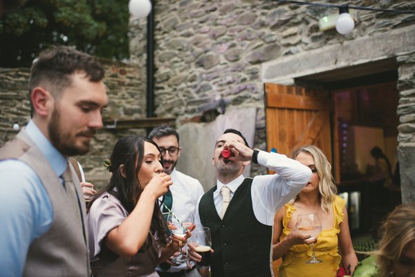 Men and woman drinking shot beer pong game