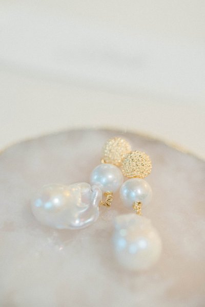 Pearl earrings jewelry placed on table