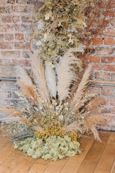 Flower detail bricked wall on wooden table