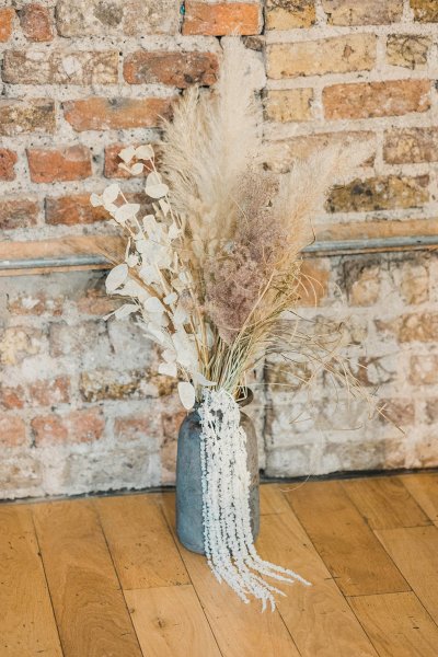 Flower detail bricked wall on wooden table