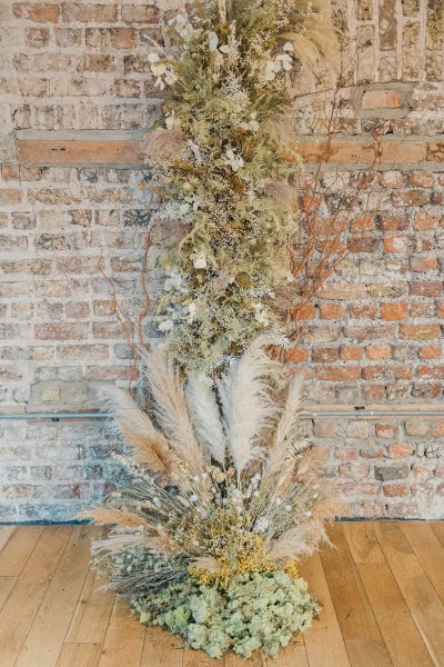 Flower detail bricked wall on wooden table