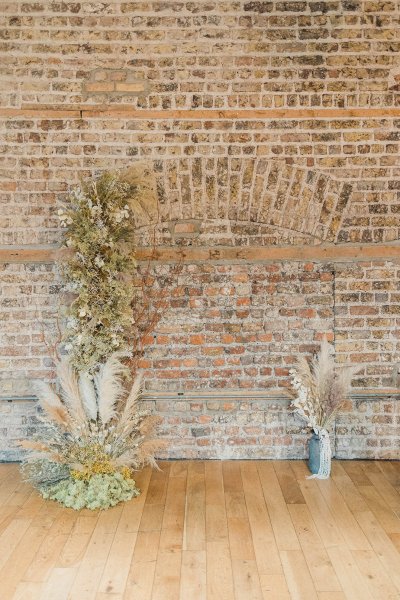 Flower detail bricked wall on wooden table