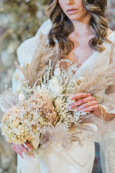 Bride ring hand jewelry detail and flowers