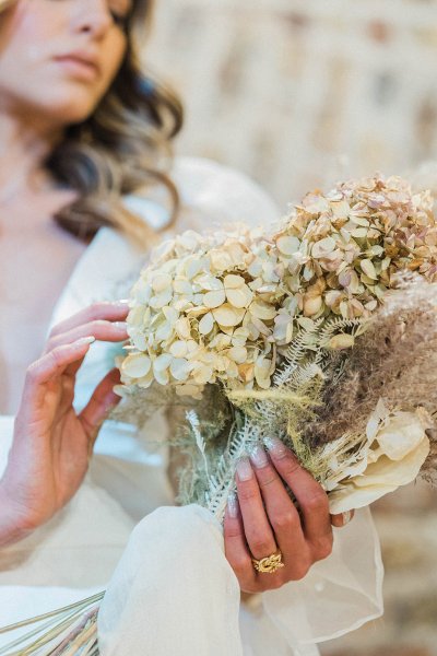 Bride ring hand jewelry detail and flowers