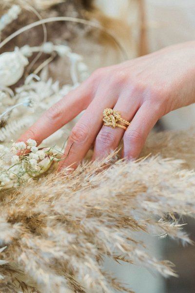 Bride ring hand jewelry detail and flowers