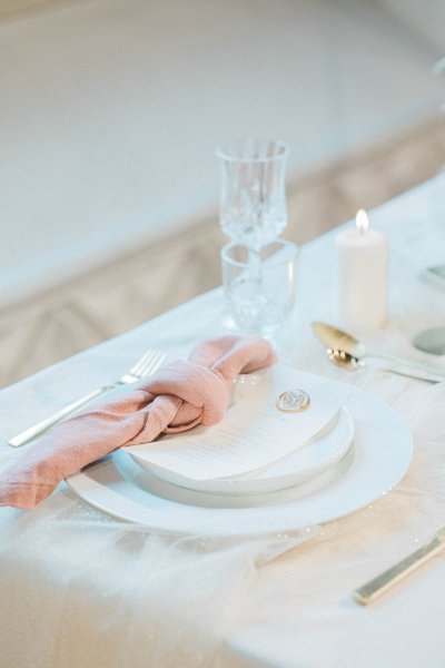 Pink salmon coloured serviette table dining room interior setting