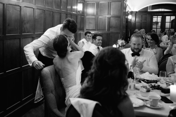 Black and white bride and groom kissing kiss