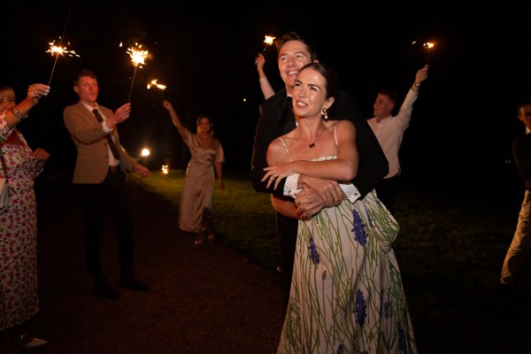 Bride and groom celebrating dancing hugging on the dancefloor