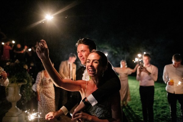 Bride and groom celebrating dancing hugging on the dancefloor