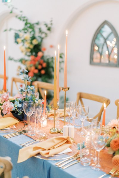 Empty interior room setting candles lit table and chairs pink vibe cutlery