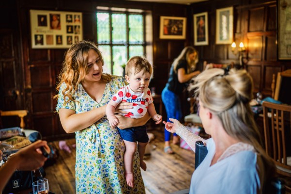 Bridesmaids getting ready for wedding little boy