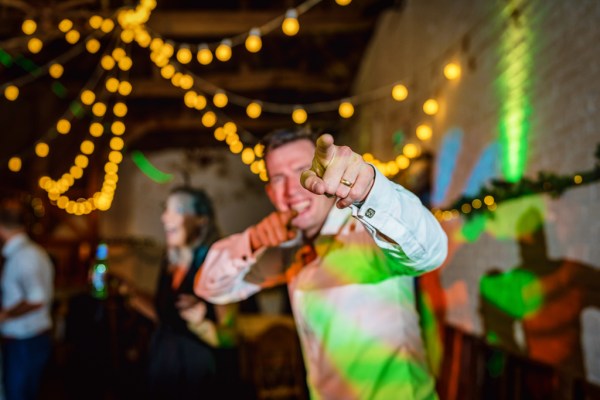 Man pointing to camera on dancefloor