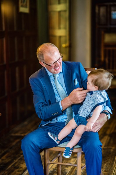 Older man with little boy on lap