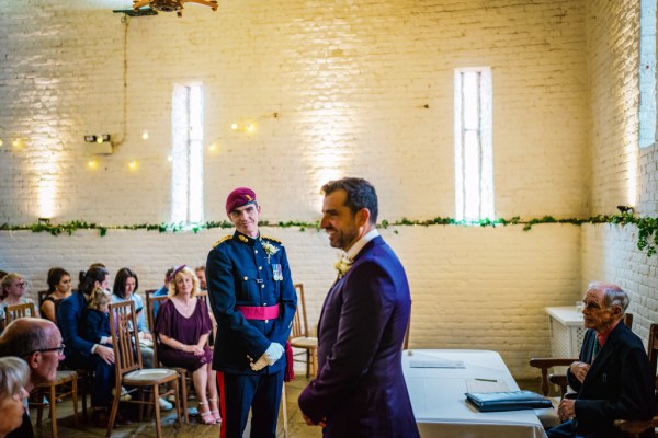 Groom and officiant waiting for bride at alter