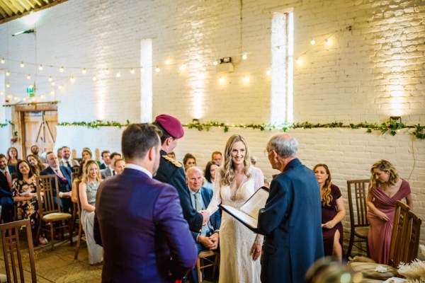 Bride groom and officiant at alter