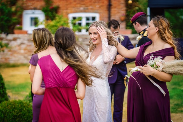 Guests and bride laughing smiling and chatting