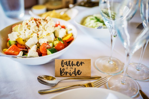 Father of the bride and salad chicken bowl in background