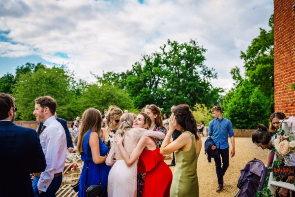 Bride hugs friends/guests