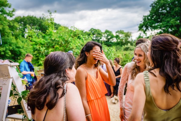 Atmosphere shot of guests and women chatting laughing