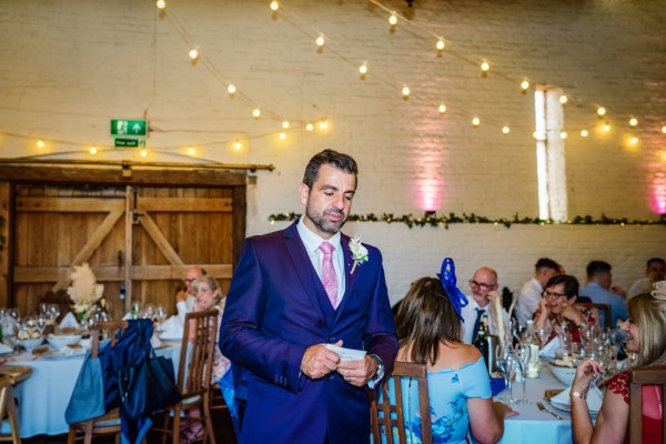 Groom in dining room ballroom giving speech