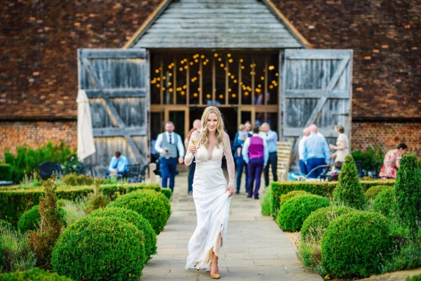 Bride walking in garden