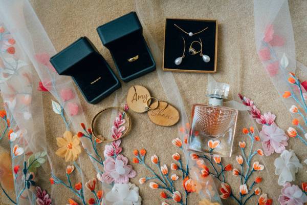 Wedding bands in box flowers detail and bead earrings