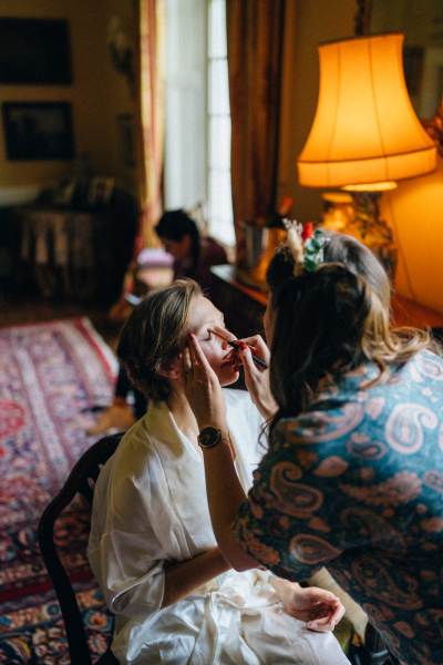 Bride getting her makeup done by MUA