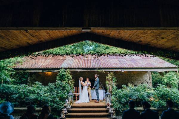 Bride groom officiant on the steps to ceremony