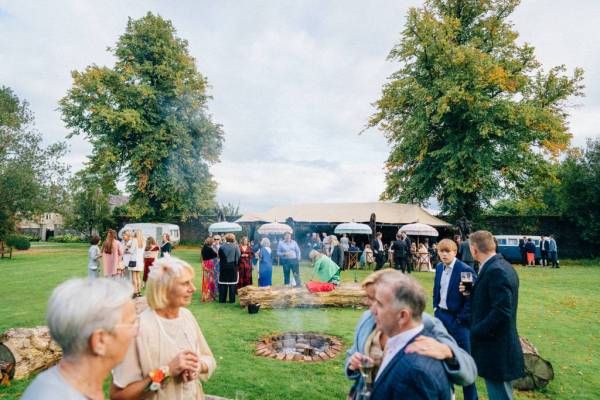 Firepit in middle guests atmosphere shot