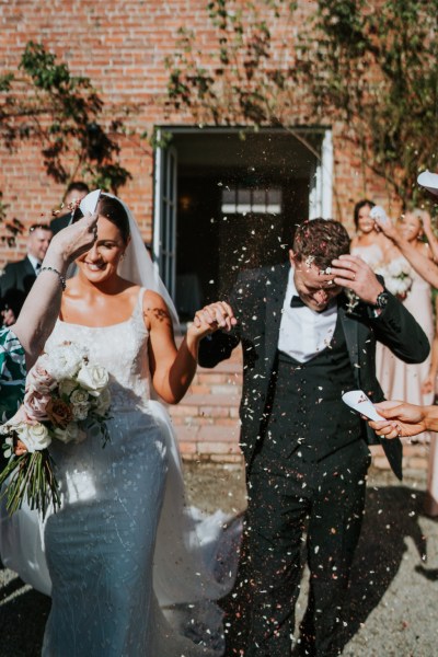 Atmosphere shot just wed couple bride and groom confetti