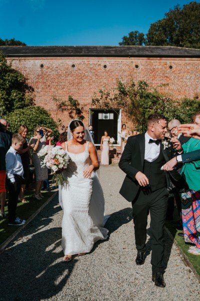 Atmosphere shot just wed couple bride and groom confetti