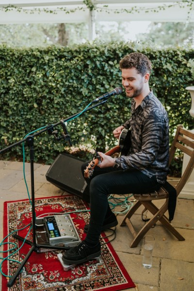 Wedding band musician guitarist plays music