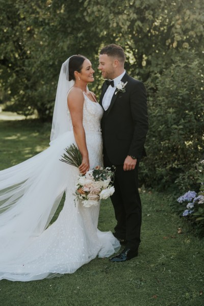 Exterior shot of bride and groom in garden