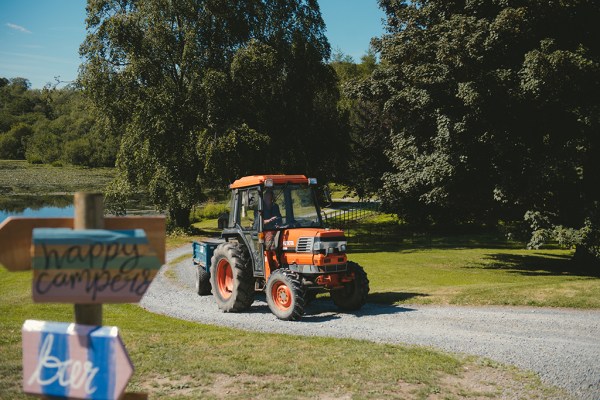 Tractor driving on pathway grass forest park garden