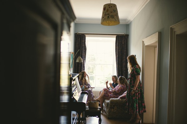 Bridesmaids and bride get ready piano in shot