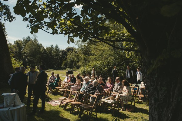 Guests begin to sit at wedding ceremony begins