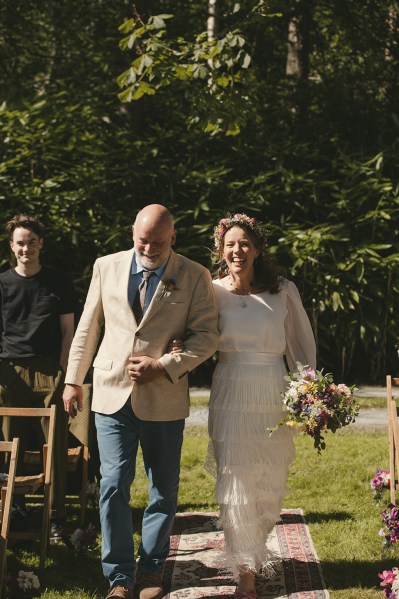 Father of the bride walks down the aisle