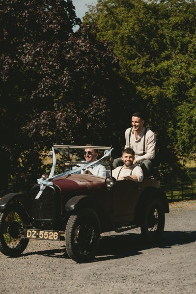 Groom and groomsmen drive the wedding car