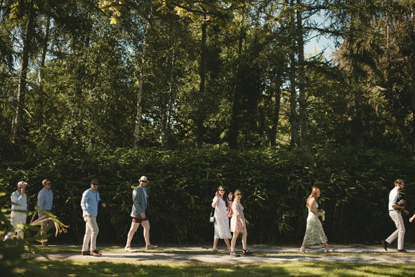 Atmosphere shot of guests walking on the grass