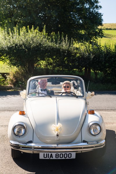 White wedding car father of the bride sunglasses