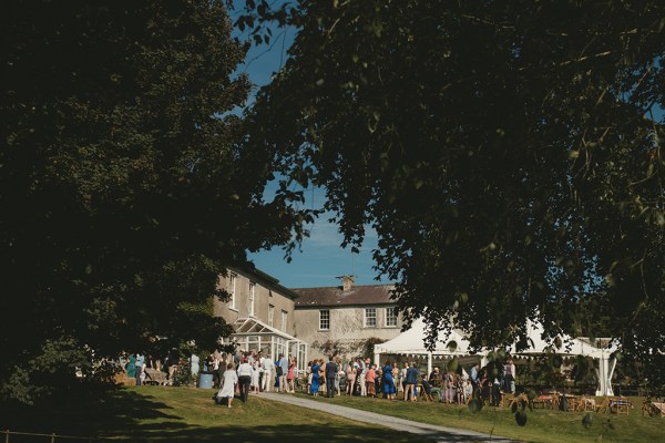 Atmosphere shot of wedding venue marquee and guests