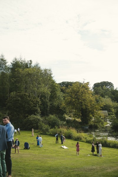 Park garden setting trees grass and guests