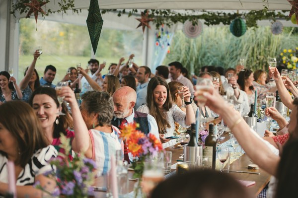 Marquee and guests during speeches table setting