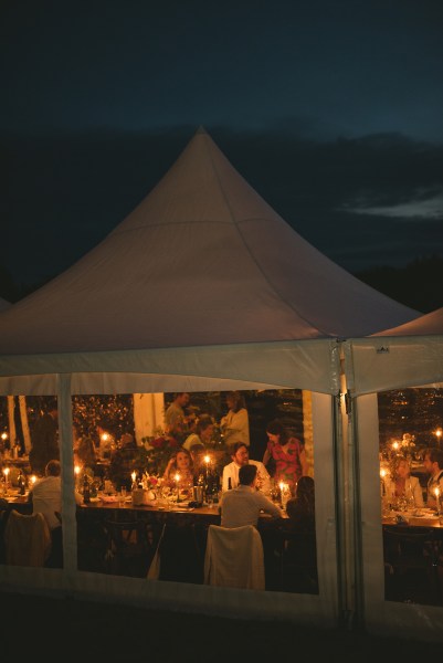 Tent and guests setting a nighttime