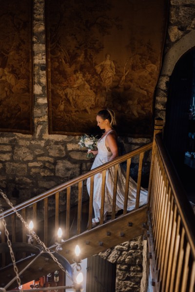 Bride walks down the staircase