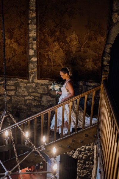 Bride walks down the staircase