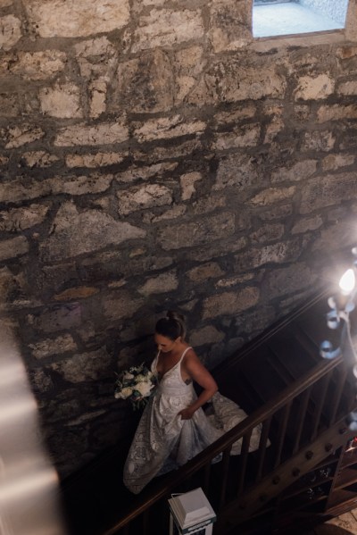 Bride walks down the staircase