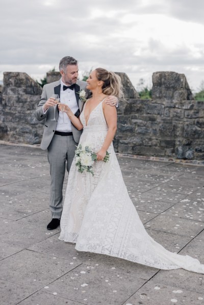 Bride and groom castle exterior rooftop