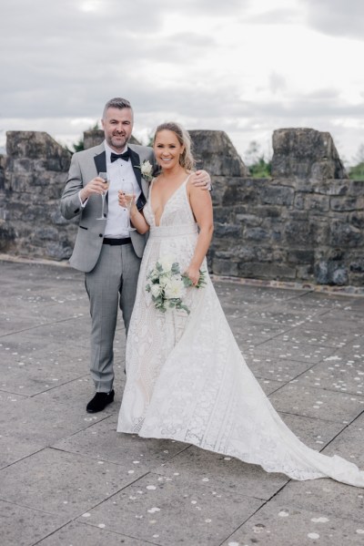 Bride and groom castle exterior rooftop