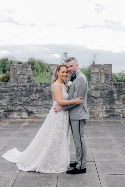 Bride and groom castle exterior rooftop